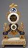 An extremely beautiful and fine quality Directoire gilt bronze, enamel and white marble skeleton clock of eight day duration
